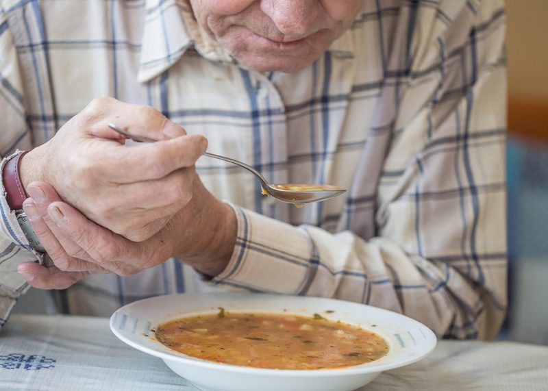 Elderly-man-diagnosed-with-Parkinson’s-struggling-to-eat